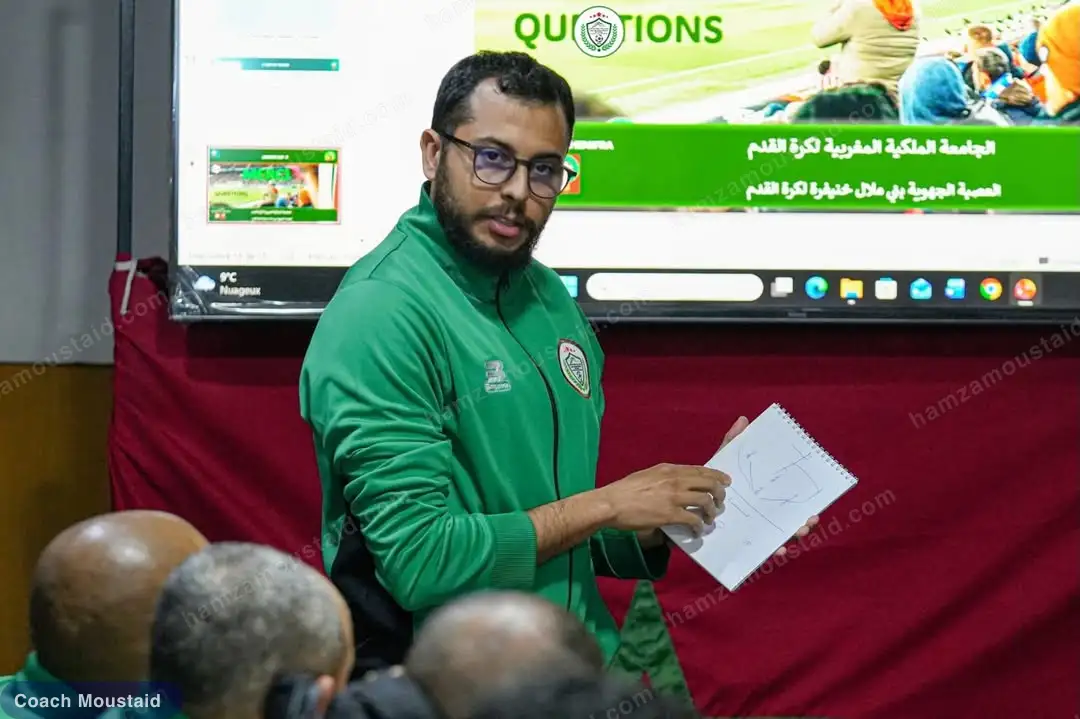 Hamza Moustaid presenting a session plan to the group during the CAF C course, in a Royal Moroccan Football Federation classroom
