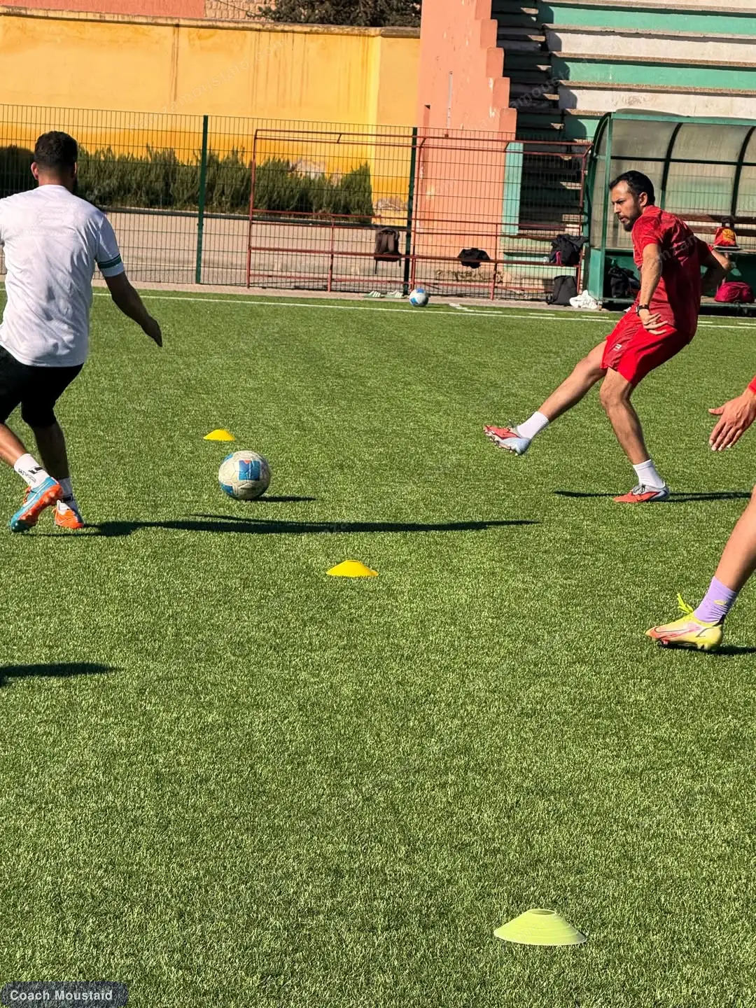 A practical drill in progress on the CAF C course pitch, ball and marker discs in play
