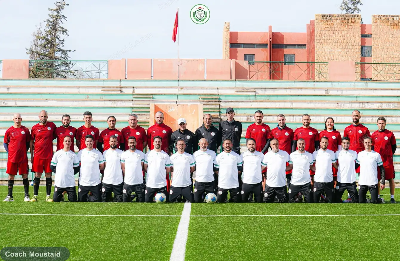 The full CAF C course cohort photographed together on the pitch